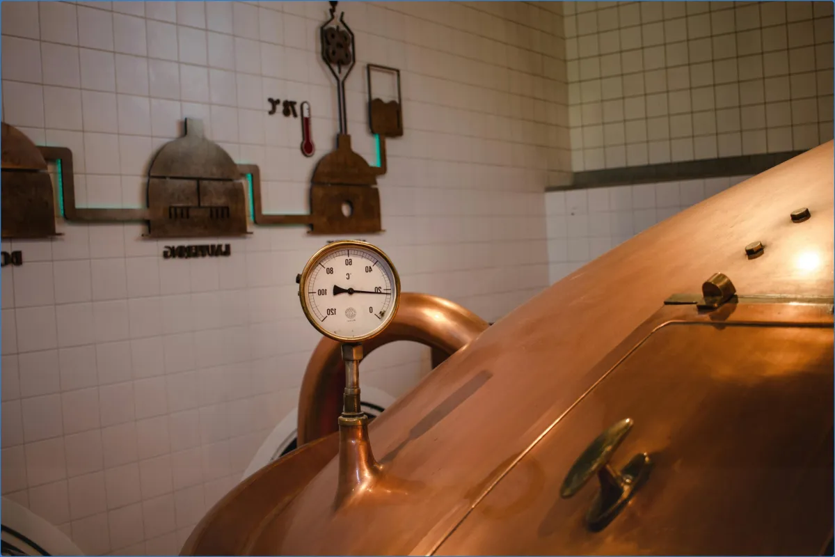 Pressure gauge on a copper brewing tank.
