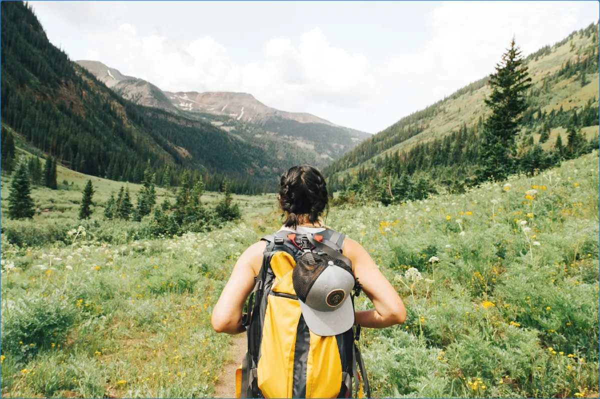 Person hiking in a mountain valley