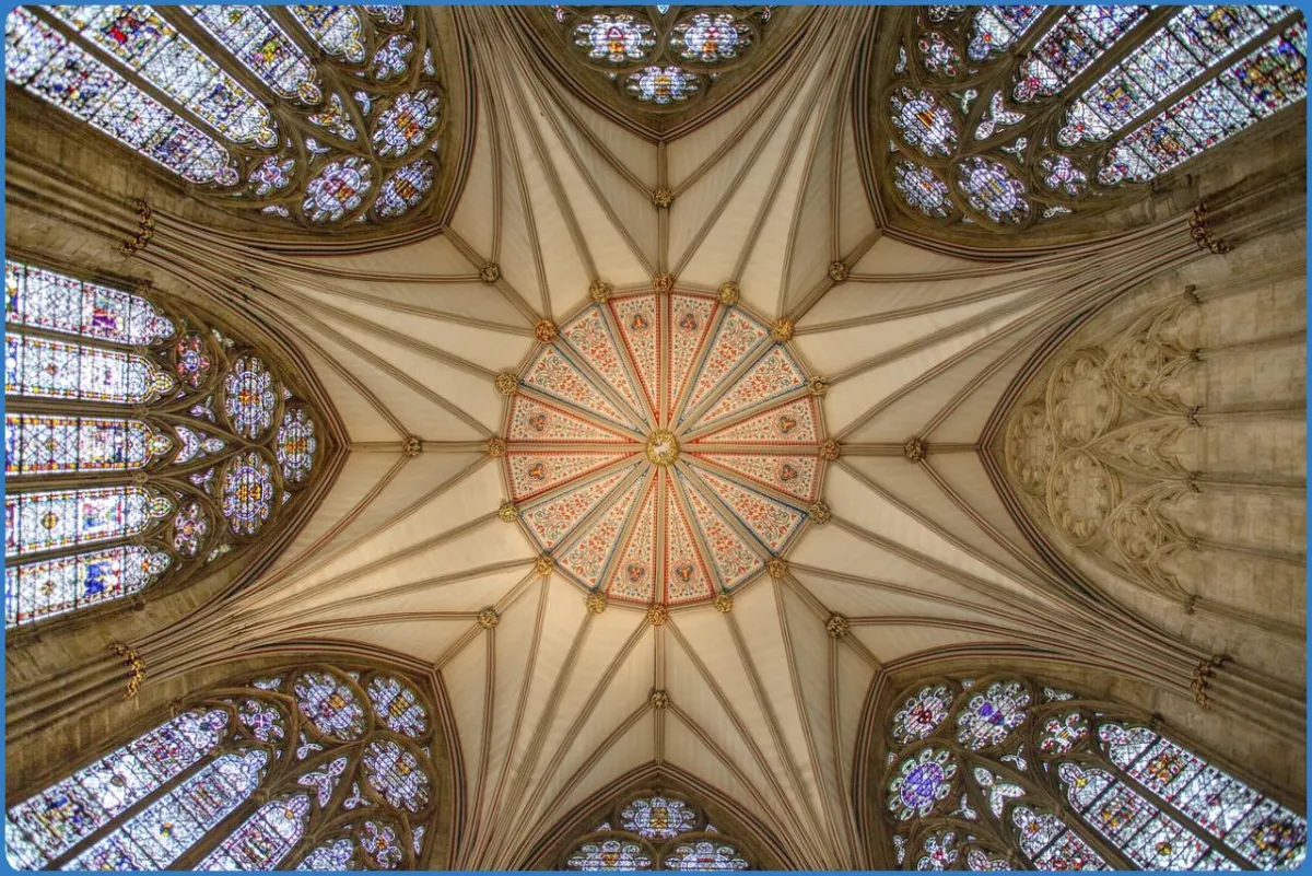 Ornate cathedral ceiling with stained glass windows