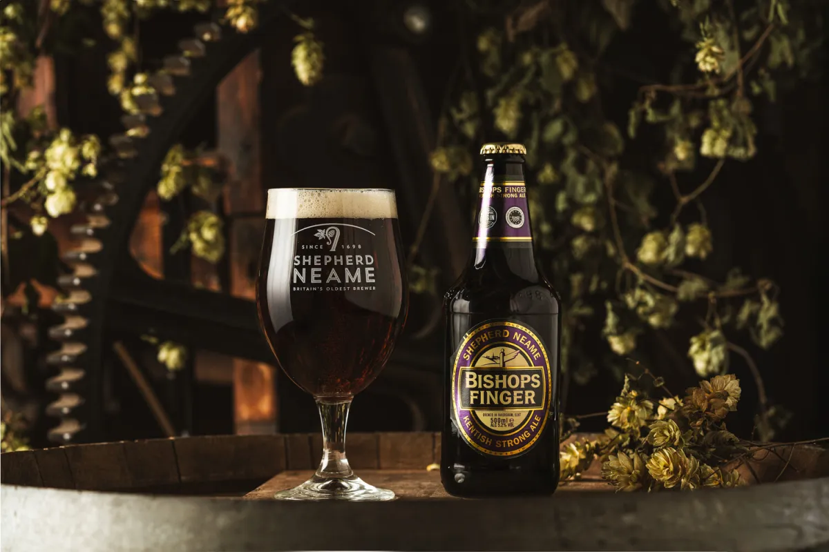 Glass and bottle of Shepherd Neame Bishops Finger beer.