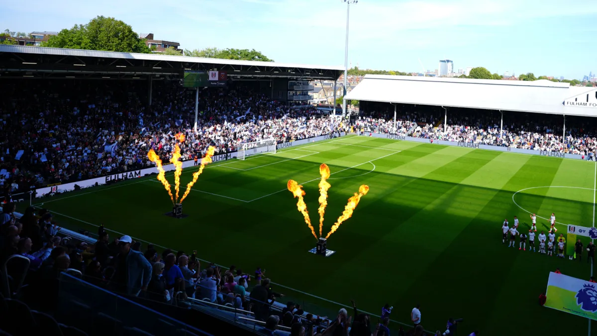 Soccer stadium with crowd and pyrotechnics on field